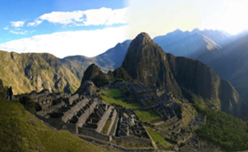 Machu Picchu on its ridge with Huayna Picchu rising behind it