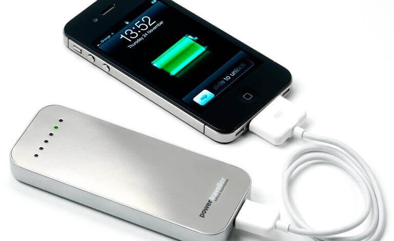 A power bank charging a phone by cable